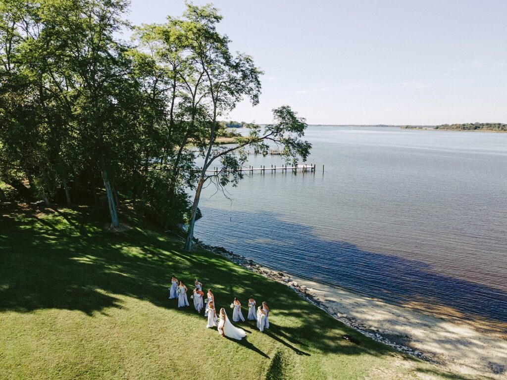 aerial view of a wedding party out on the waterfront for a private estate wedding