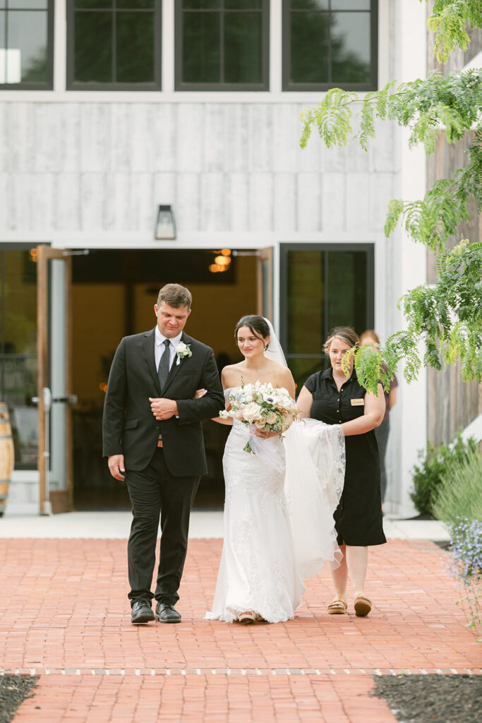 Bride walking down the aisle for an outdoor ceremony at Kent Island Resort